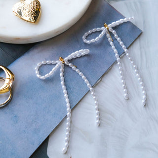 Pearl Bow Drop Earrings - Nickel & Suede