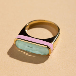 Gold ring with wide turquoise quartz stone and pink enamel band around stone